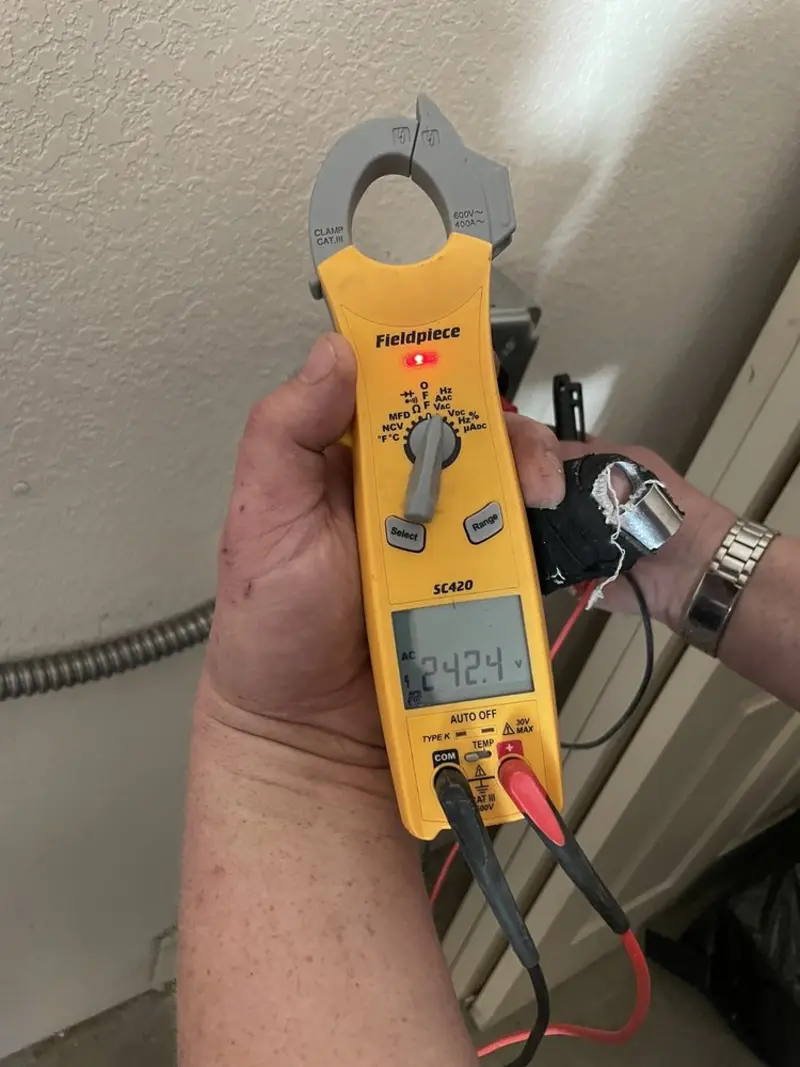 Voltage testing with clamp meter during Generator Installation in Rancho Calaveras
